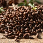 Enhance dishes with cloves, featuring whole dried flower buds in a rustic kitchen setting.
