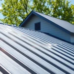 Showcase of residential metal roofing on a contemporary home with lush surroundings.